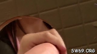 Horny slut sucks fake dick at gloryhole and gets milk cans slimed