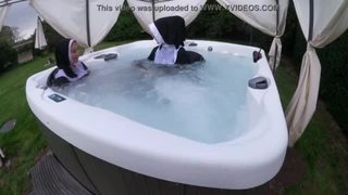 Two naughty nuns get wet in the hot tub