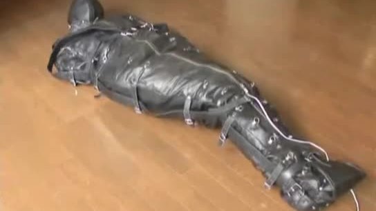 Ballgagged Asian Girl Tied Into A Leather Sleepsack Teased And Vibed